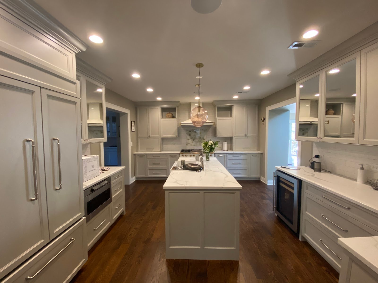 Completed kitchen remodel with large island and hardwood floors