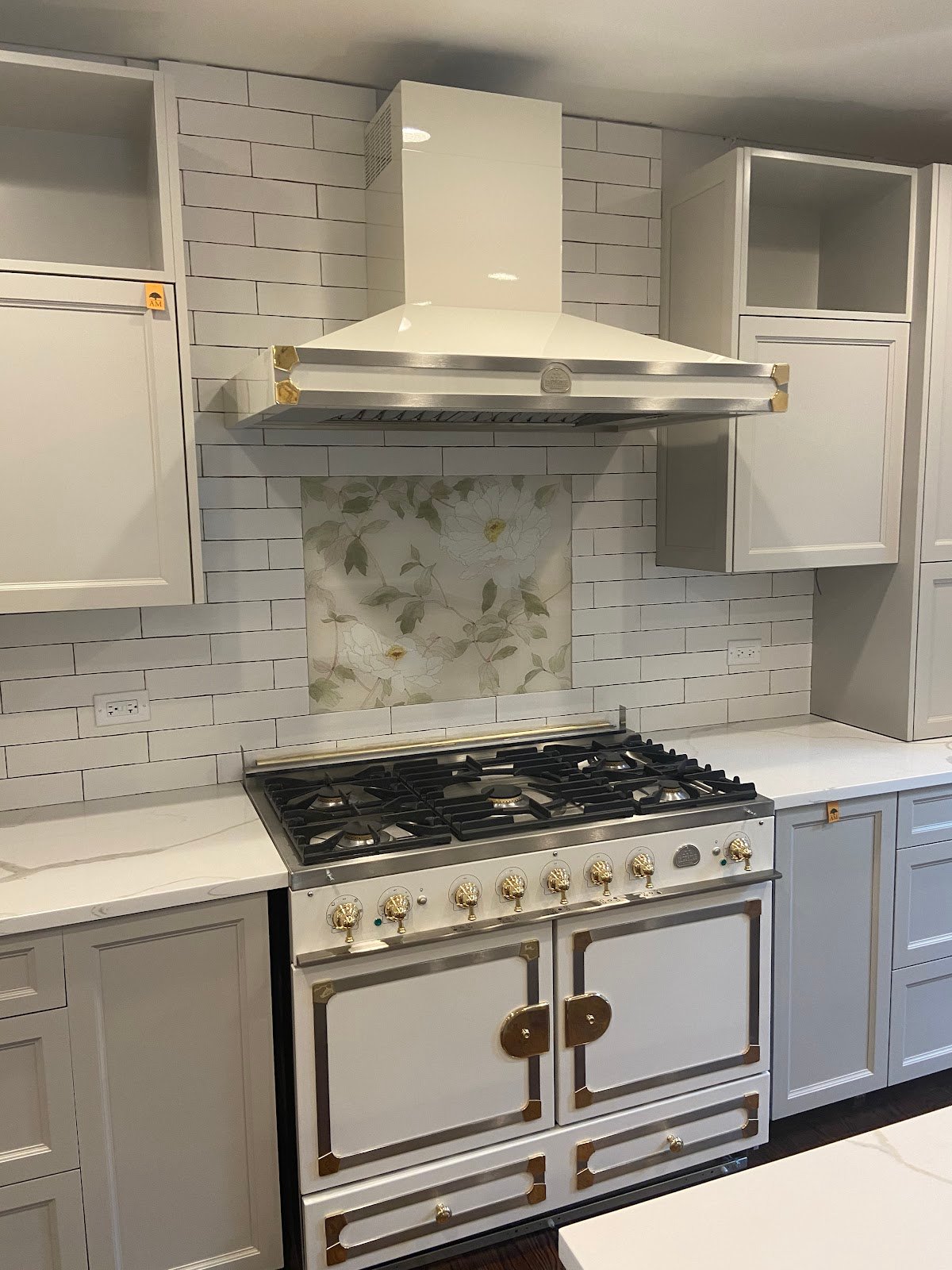 La Cornue range with custom hood and subway tile backsplash