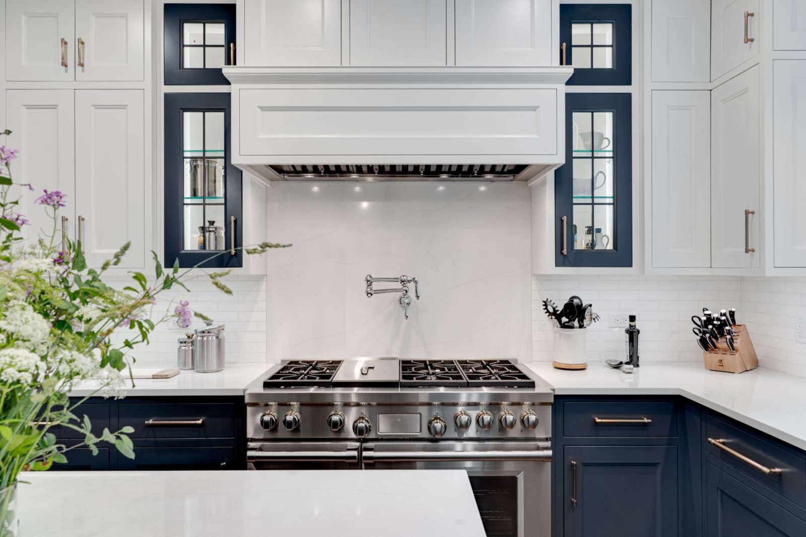 Kitchen remodel with navy and white custom cabinetry